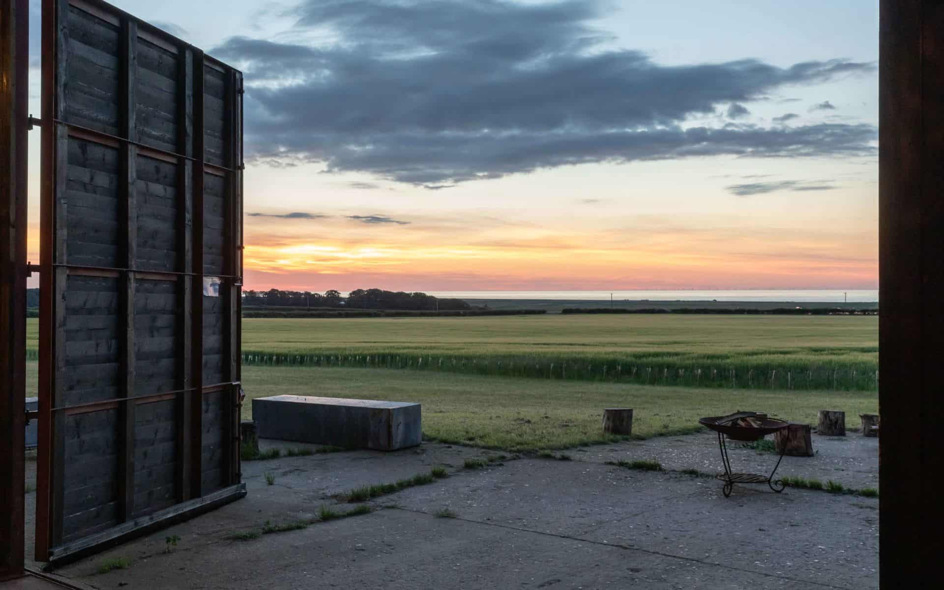 Sunset view over Norfolk countryside from a camping site at Barn Drift, Norfolk.